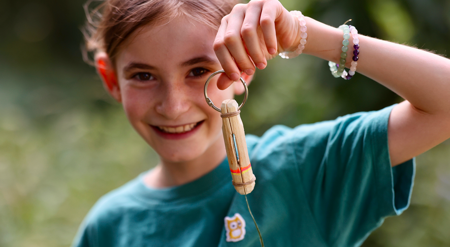 child showing a finished marmot whistle