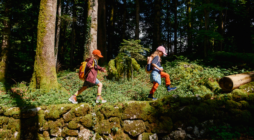 Kids dressed for forest kindergarden in the woods