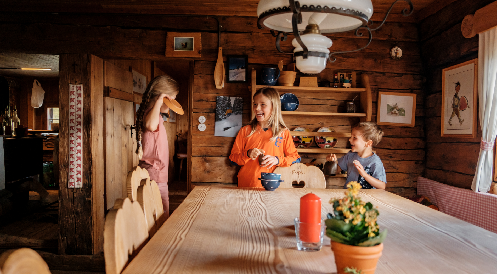 Happy children in an alpine hut.